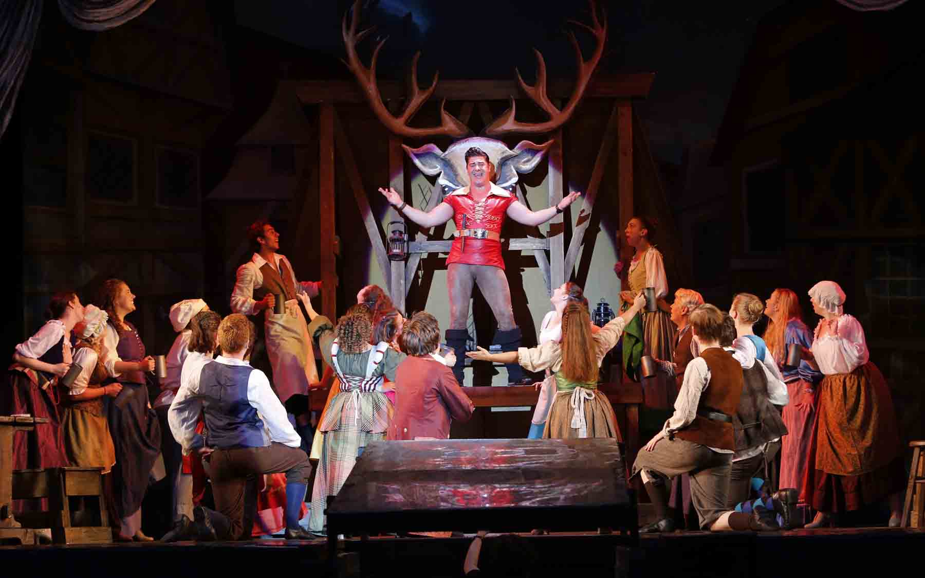 Dane Szohner as Gaston,with the cast of Beauty and the Beast. Photo © Tim Matheson.