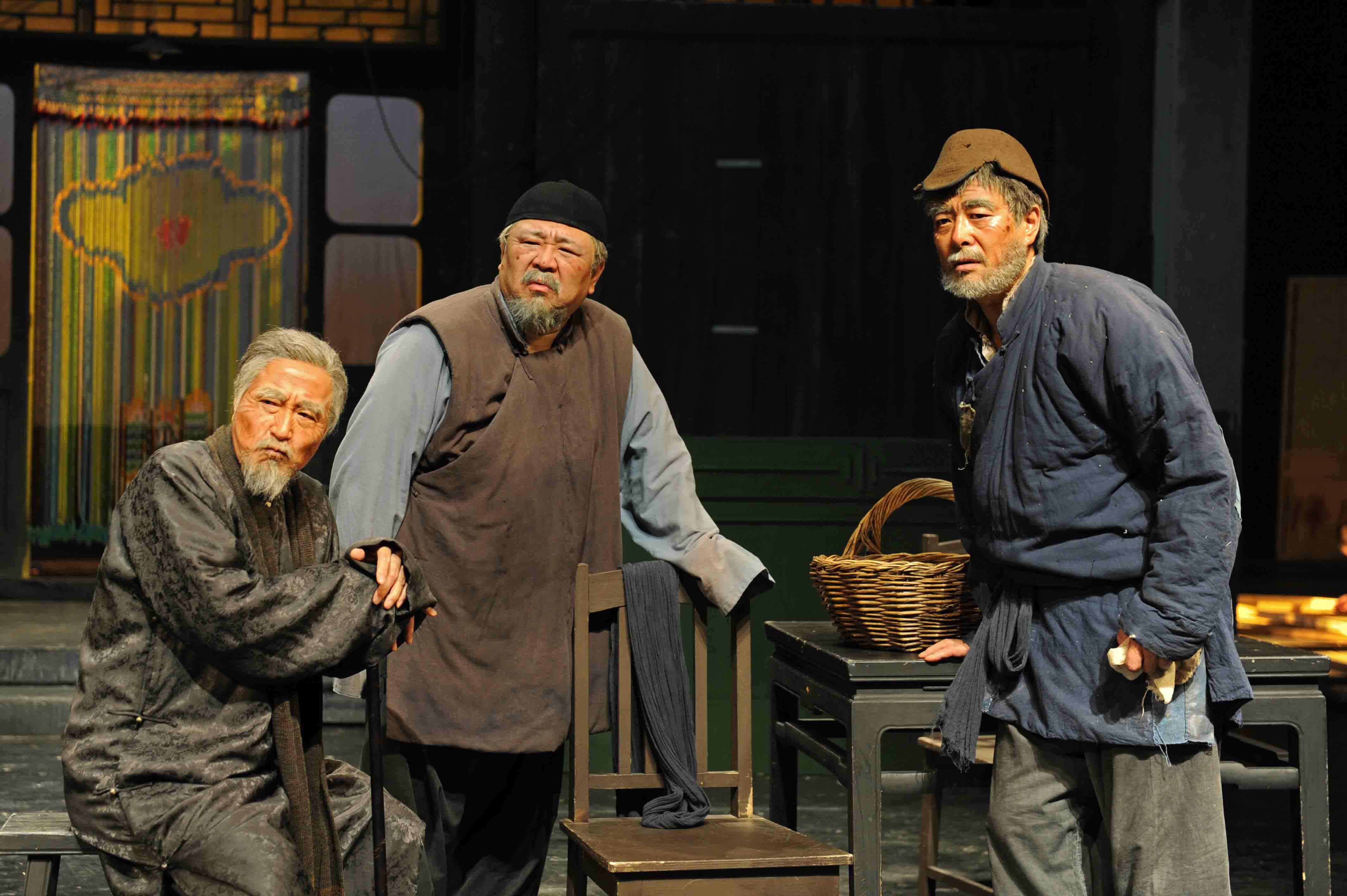 Yang Li Xin, Liang Guan Hua, and Pu Cun Xin in Act III of Teahouse, by Lao She. Photo © Beijing People's Art Theatre.